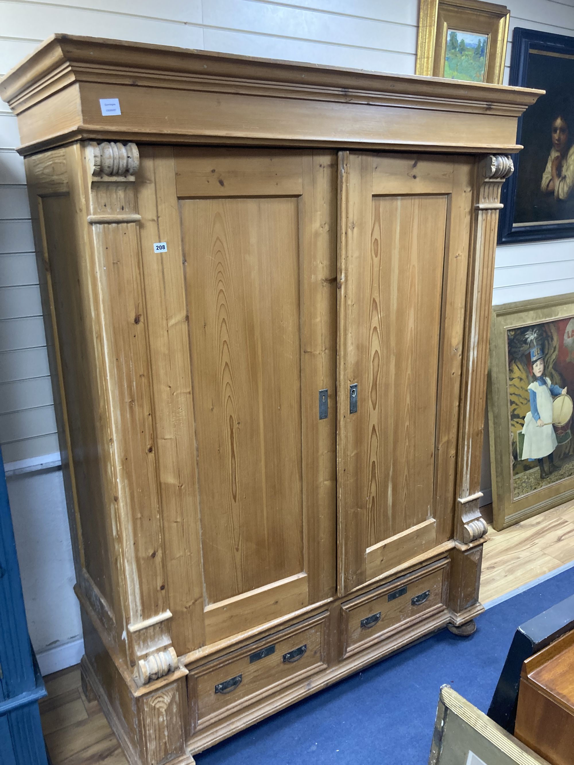 A 19th century East European pine armoire, width 150cm depth 66cm height 203cm